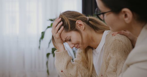 A Psychiatrist Comforting a Woman