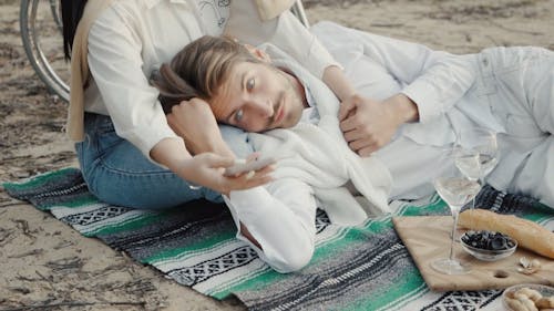 Man Lying On a Woman's Lap