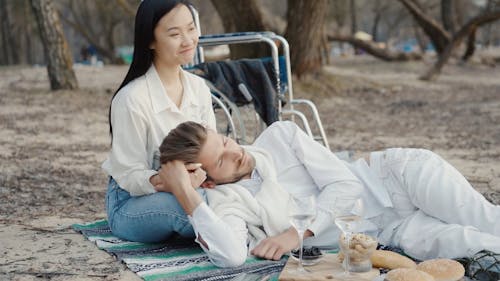 Man Lying On a Woman's Lap