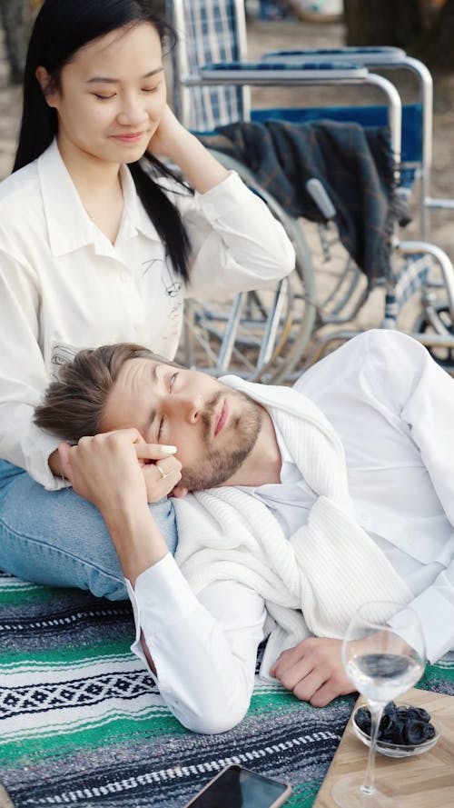 Man Lying On Woman's Lap