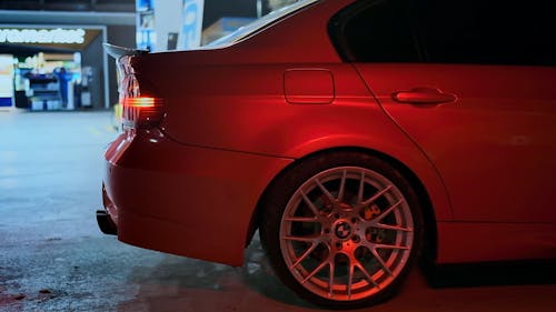 Red Car Parked at the Gasoline Station