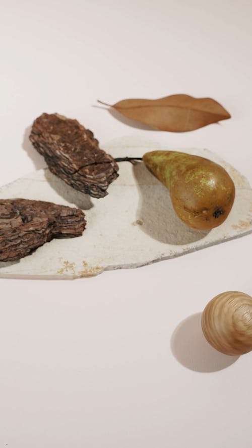 Brown Wood and Fruit on White Surface