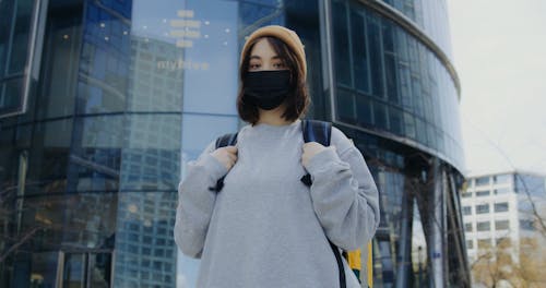 Low-Angle Shot of Woman Carrying a Thermal Bag