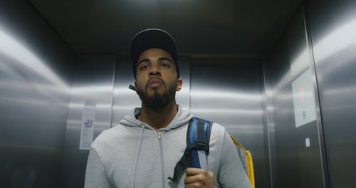 Man Exits From an Elevator