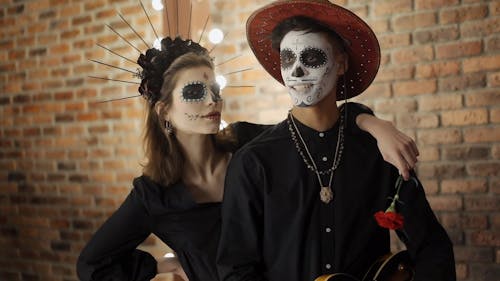 A Couple with a Muertos Face Painting