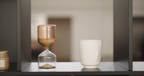 Person Picking a Mug From Shelf