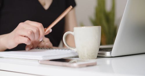 Person Working and Drinking Coffee