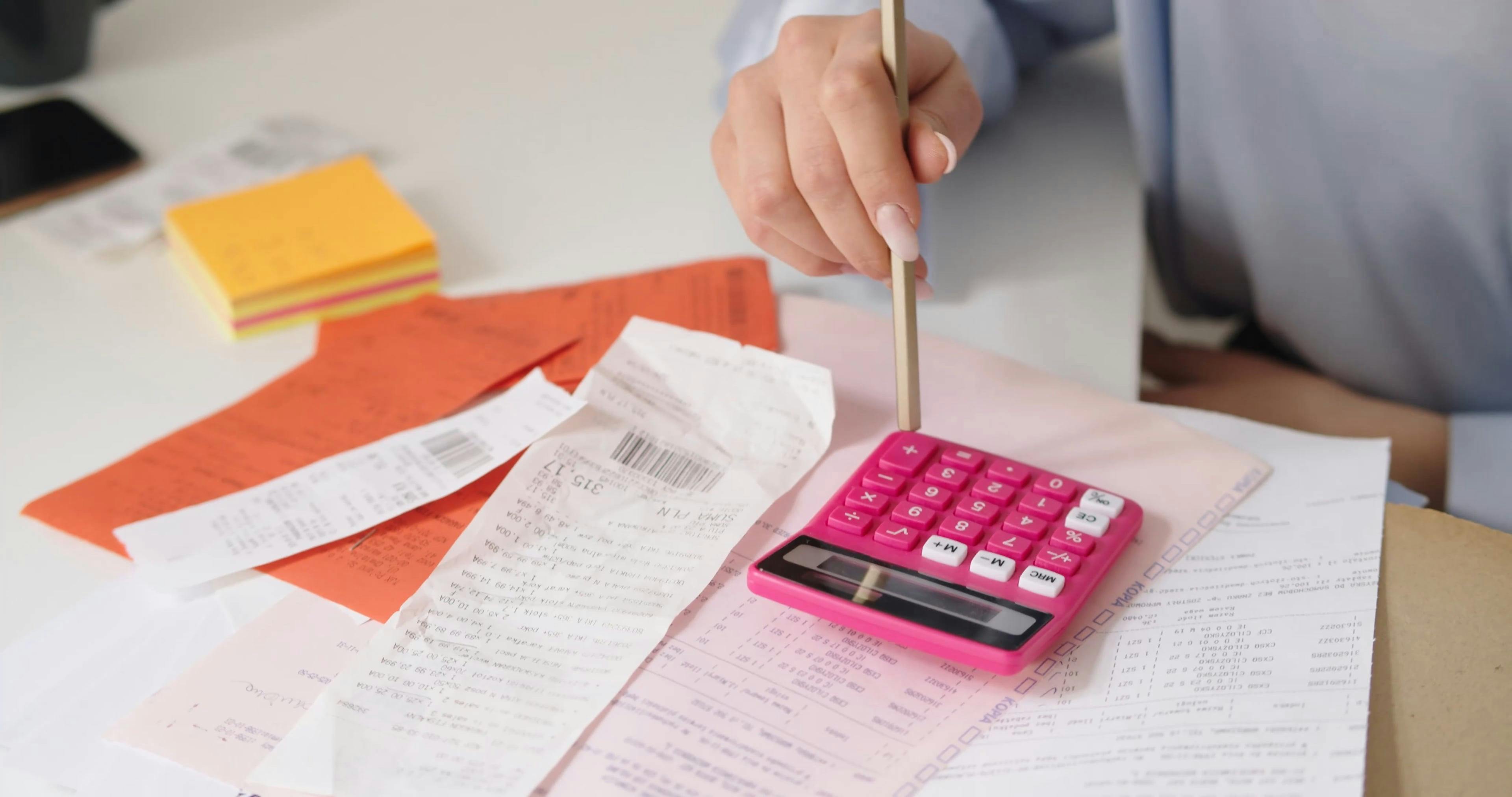 A Woman Using a Calculator \u00b7 Free Stock Video