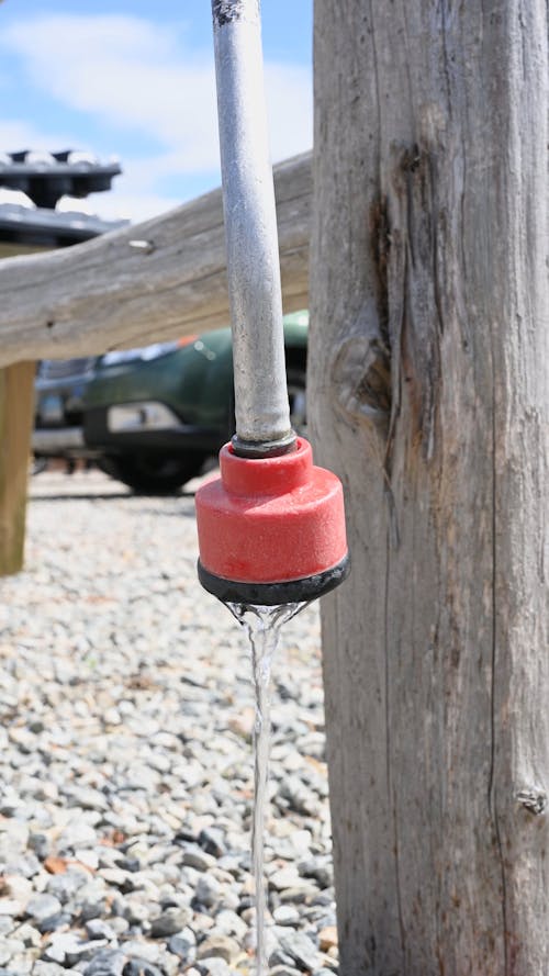 Close-Up View of Water Dripping from a Hosepipe