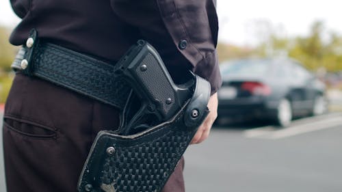 Close-Up Shot of a Gun in a Holster