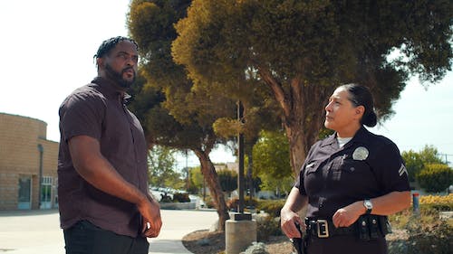 Man Talking to Police Woman