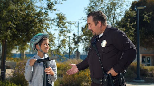 Police Officer Talking to a Boy