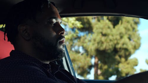 A Man Listening to the Police Officer