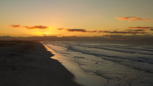 Drone Footage of Seashore During Golden Hour