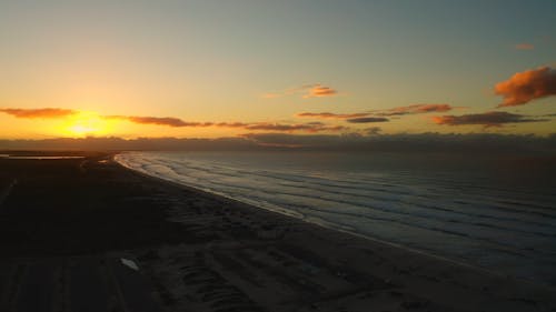 Drone Footage of Seashore During Golden Hour