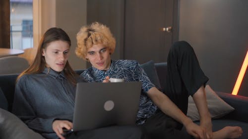 A Couple Watching using a Laptop