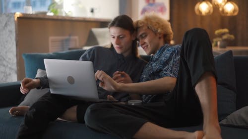A Couple Watching Together using a Laptop