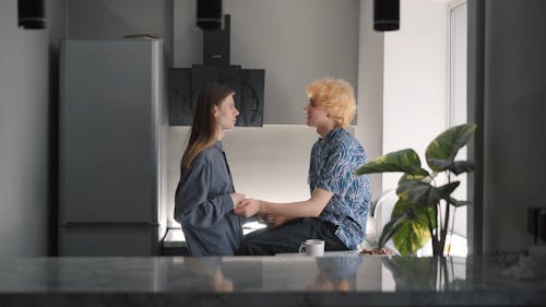 A Couple Talking in the Kitchen
