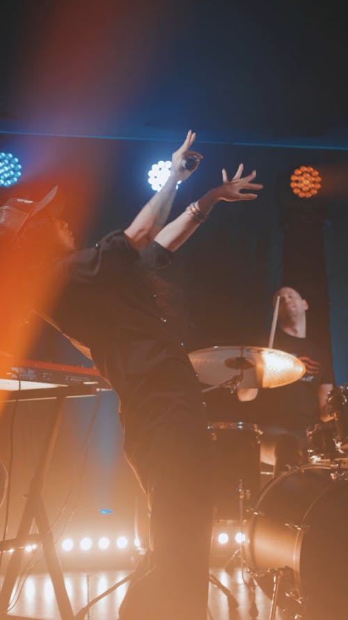 A Woman Singing with his Band