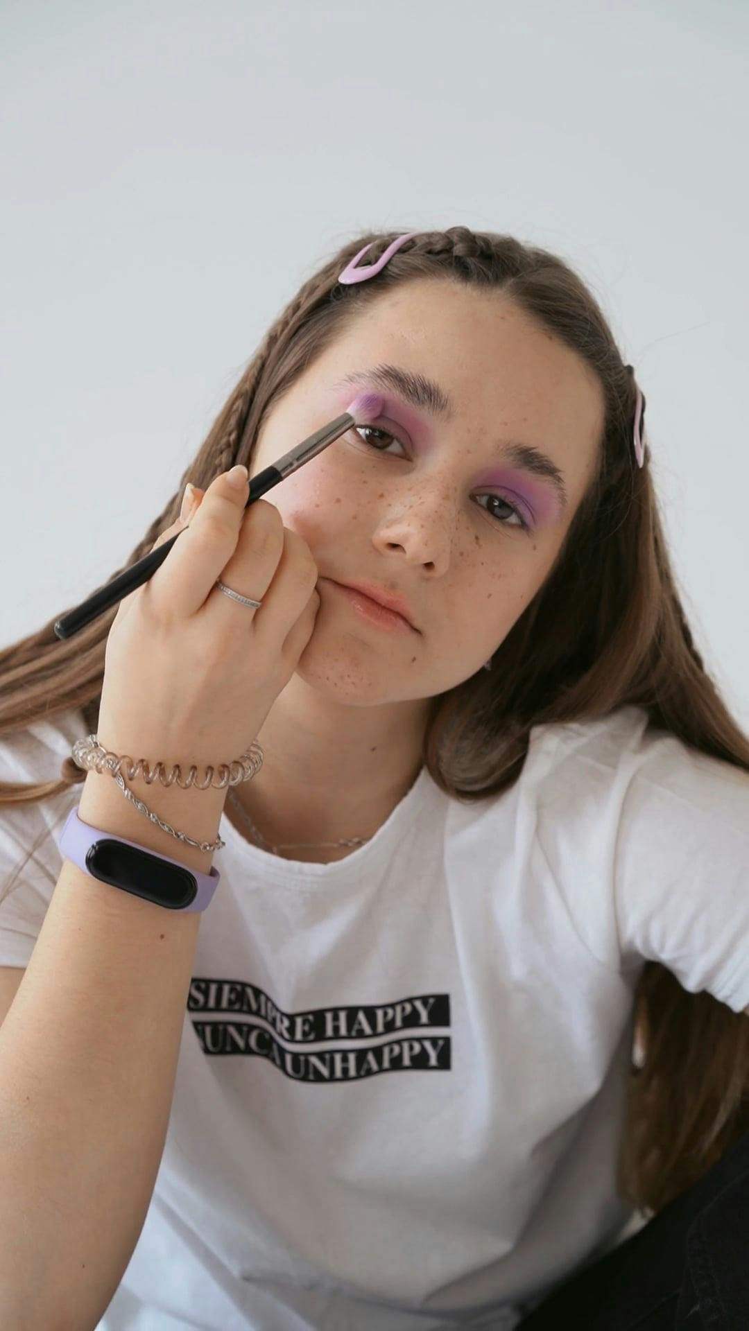 Girl Putting on Eyeshadow · Free Stock Video