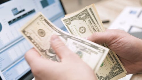 Close-Up Video of a Person Counting Money