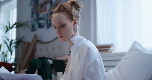 Woman Looking at Papers