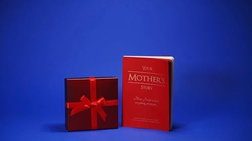 A Book beside a Red Gift Box