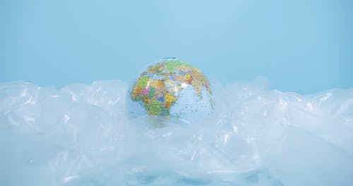 A Globe on a Surface Covered in Plastic