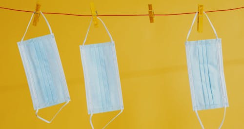 Surgical Masks Hanging from a Clothesline