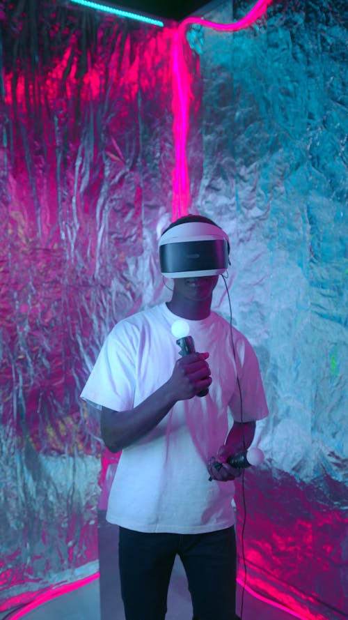 A Man Dancing while Wearing Virtual Reality Goggles