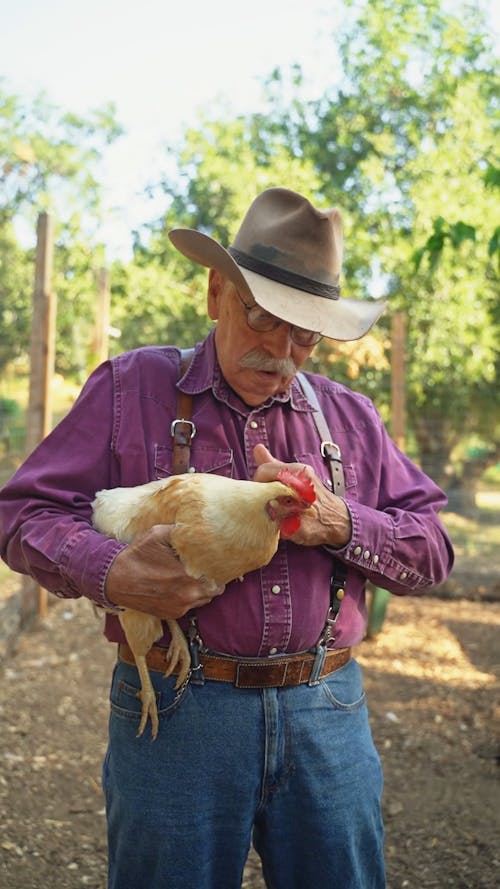 Man Holding Chicken