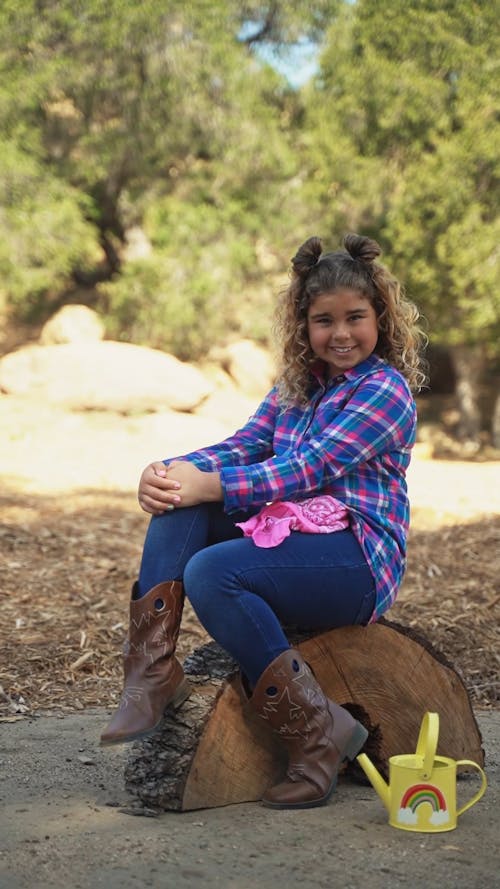 Child Outdoors Wearing Cowgirl Boots