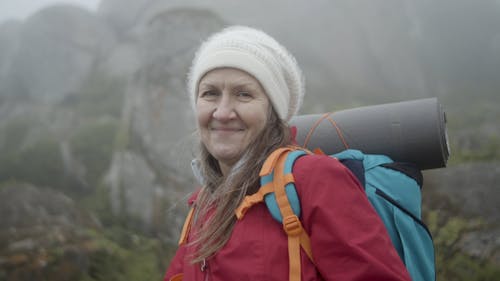 Female Hiker on a Foggy Hill