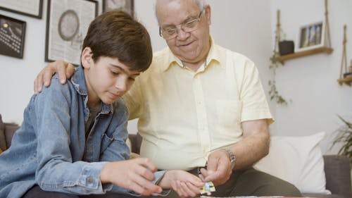 Elderly Man Spending time with a Boy