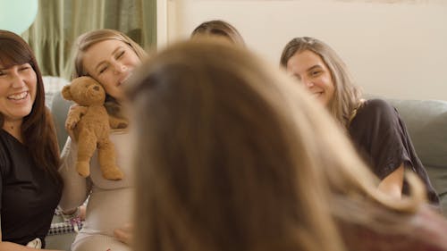 Women Smiling to the Camera while Posing