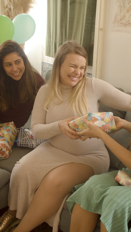 Woman Receiving a Present From Her Friend