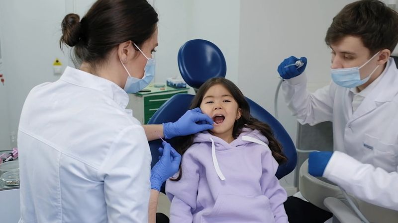 A young girl at a calm dental check-up