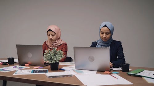 Women Wearing Hijab Using Laptops