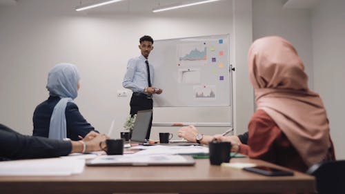 Man Presenting at a Meeting