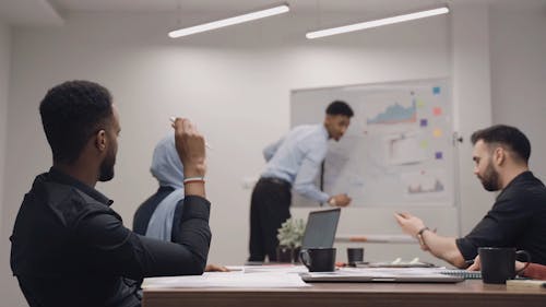 Man Writing on a Whiteboard