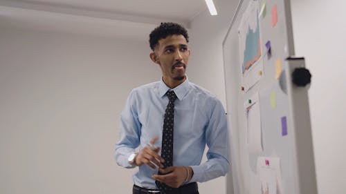 Man Presenting a Report in a Business Meeting