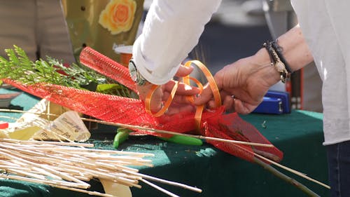 Arranging A Flowers In The Street