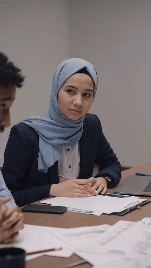 Woman Wearing Hijab at a Meeting