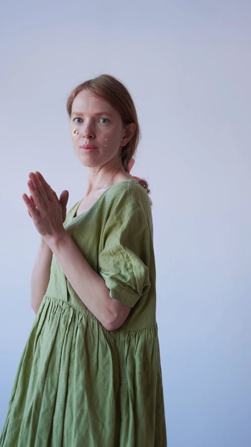 Woman Wearing Green Dress Looking at Camera