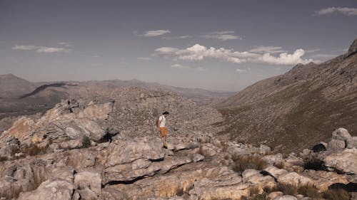 Man Hiking on a Rocky Mountain