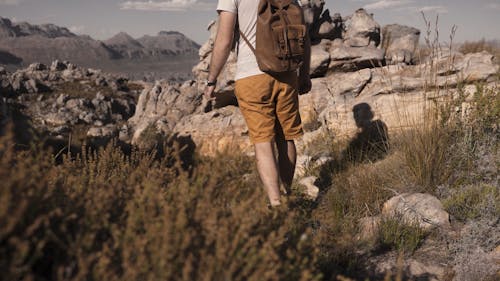 A Man Hiking in a Mountain
