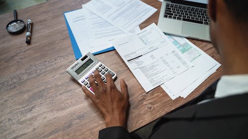 Man Using a Calculator