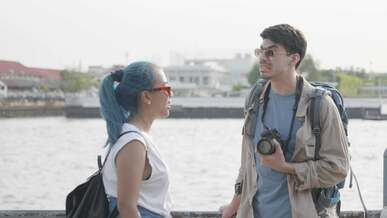 ouple talking while on the seaside
