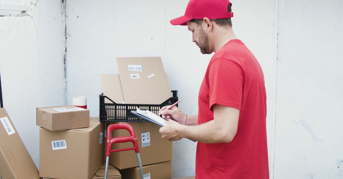Check Delivery Information A Man Checking Delivery Packages Free Stock Video Footage, Royalty-Free ...