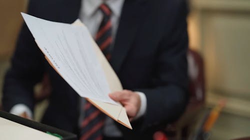 A Person Holding Documents